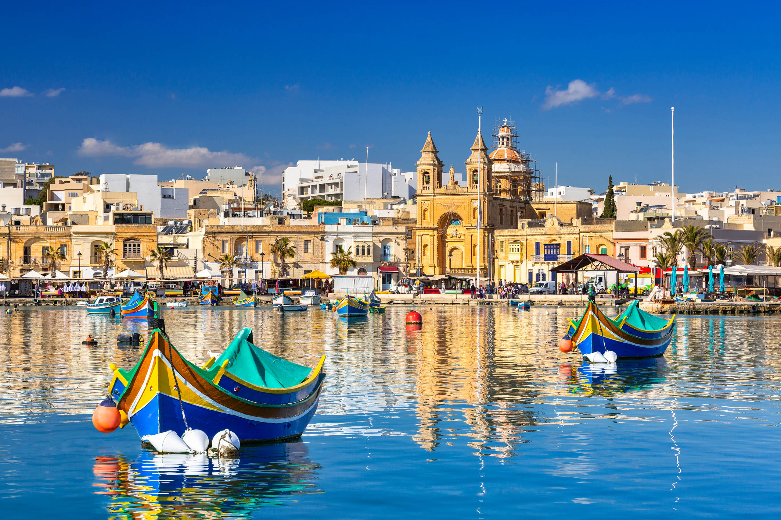 Traditional fishing boats in the Mediterranean Village of Marsaxlokk, Malta